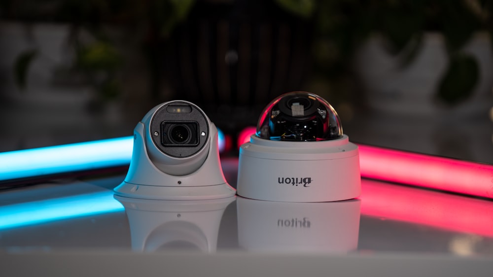 a white camera sitting on top of a table