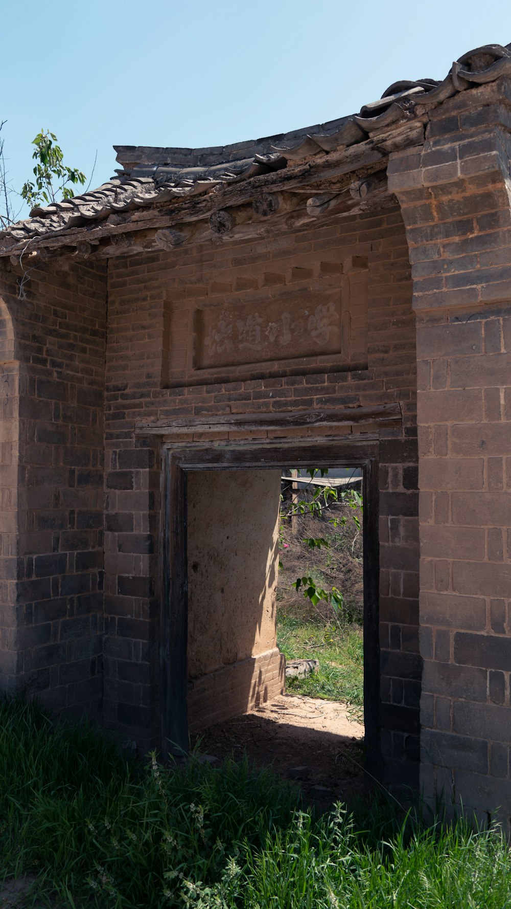 an old brick building with a small doorway