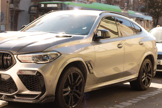 A sleek SUV parked beside a standard car, highlighting the upgrade difference.