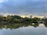 A peaceful urban park with green trees symbolizing environmental harmony.