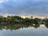 A peaceful urban park with green trees symbolizing environmental harmony.