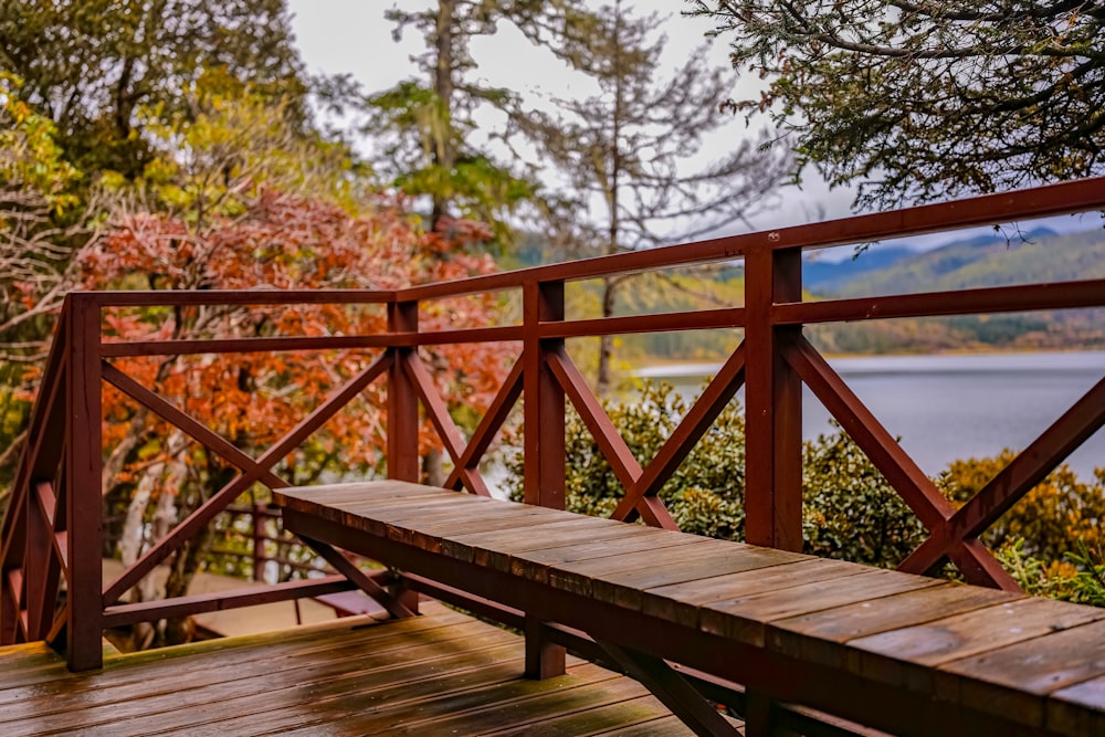 a wooden bench sitting on top of a wooden deck