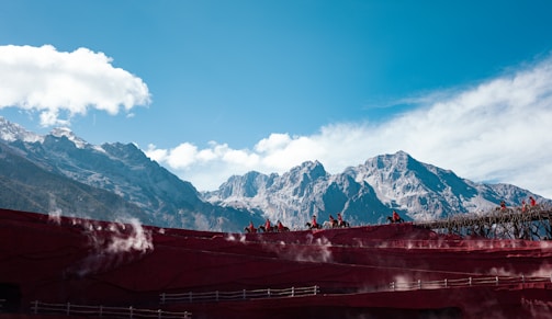 A scenic view of a mountain retreat with participants.