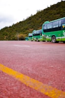 A fleet of commercial buses lined up with visibly renewed tyres ready for the road.