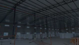 Stacks of raw materials ready for export in a spacious warehouse with natural light.