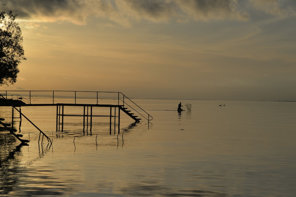 a person on a boat in a body of water