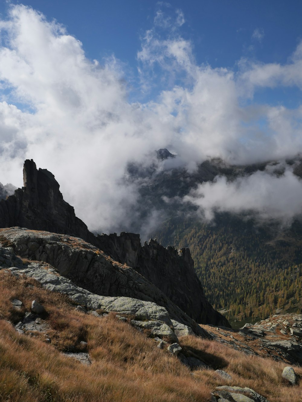 a mountain with a few clouds in the sky