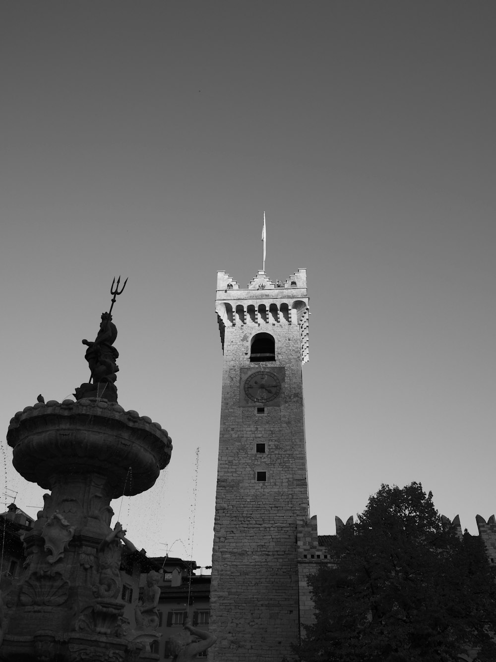 a black and white photo of a clock tower