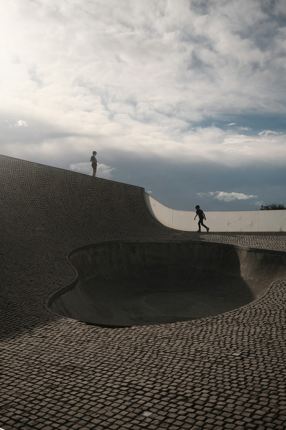 a man riding a skateboard up the side of a ramp