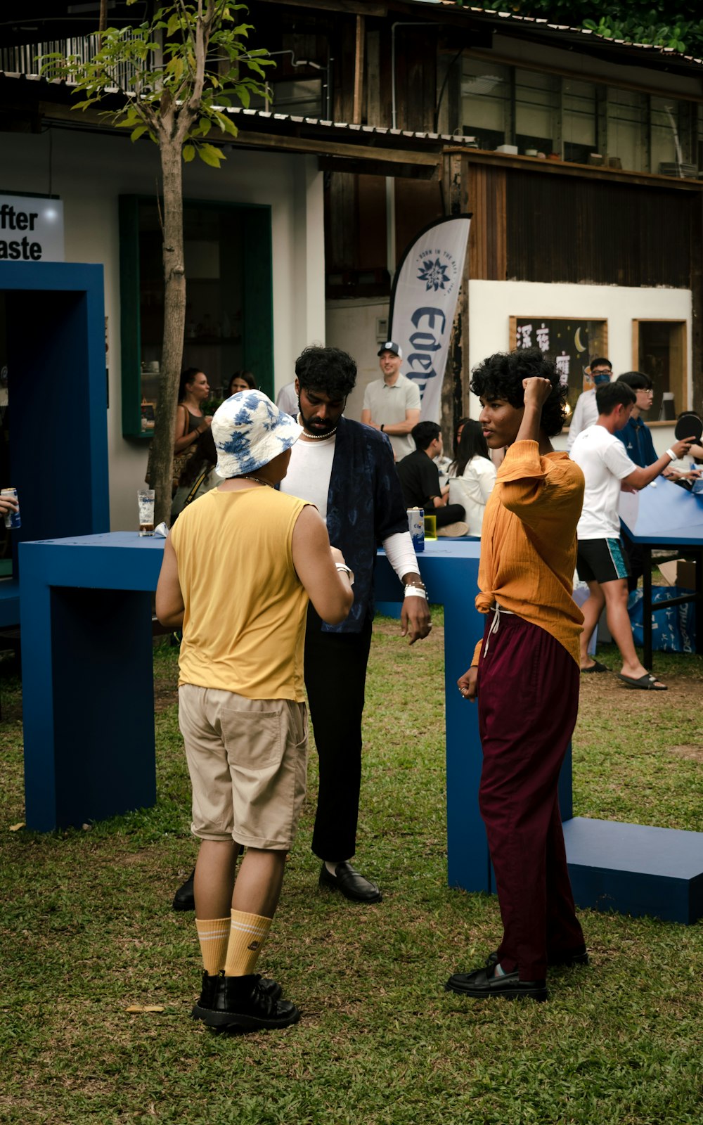 a group of people standing around each other