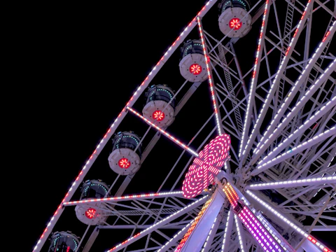 Close-up of a roulette wheel spinning with bright lights.