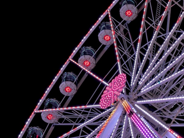 Close-up of a roulette wheel spinning with bright lights reflecting off the surface