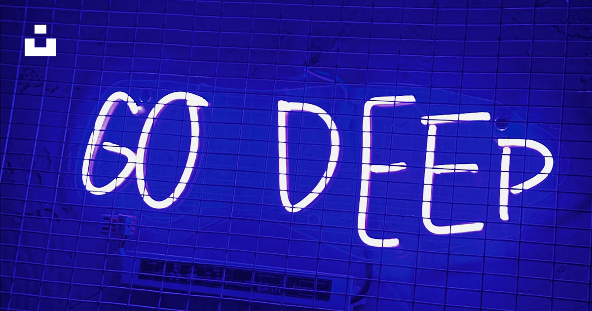 A neon sign that says go deep on a wall photo – Free Blue Image on Unsplash