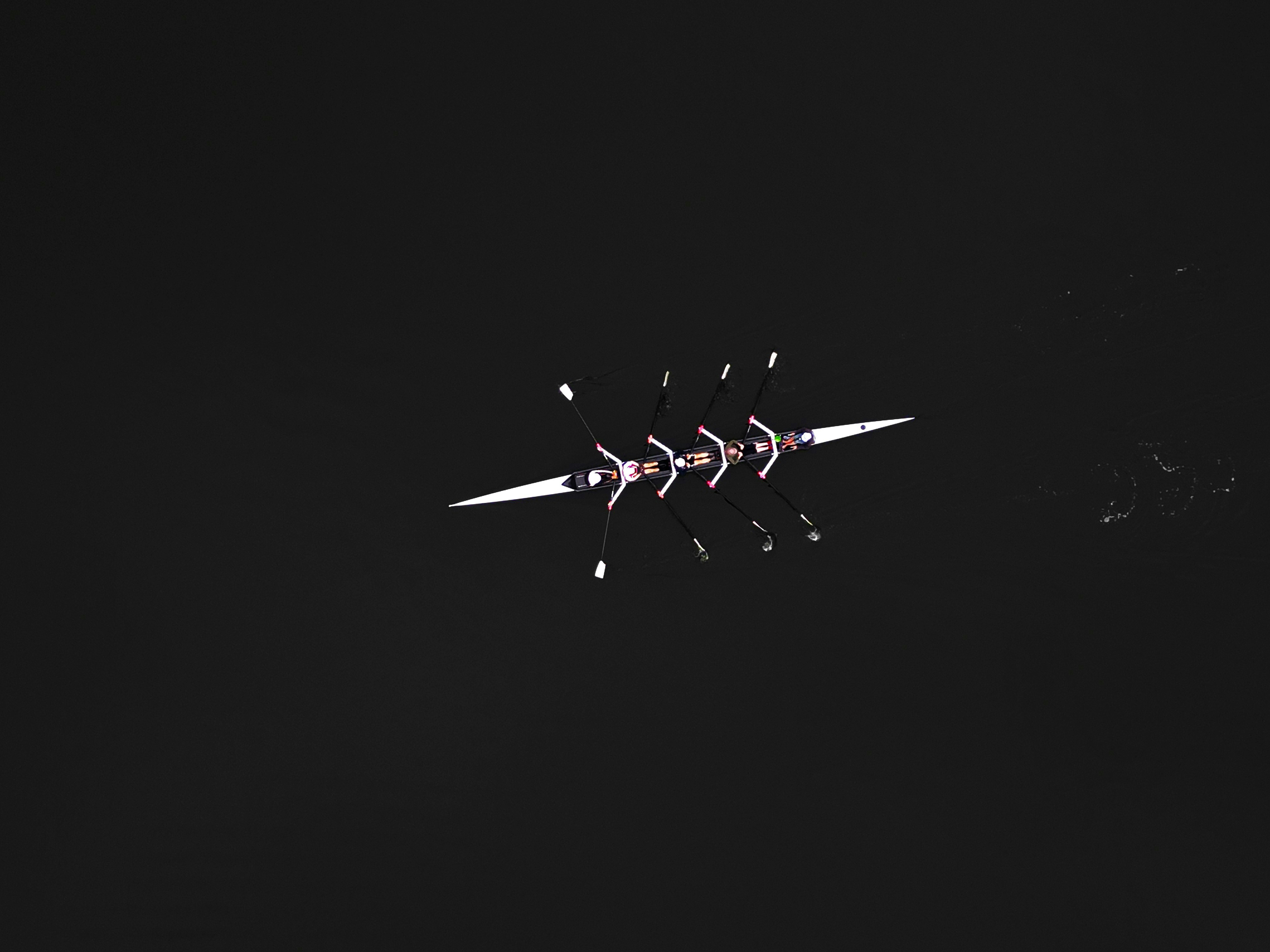 a black and white photo of a plane in the sky