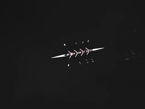 a black and white photo of a plane in the sky