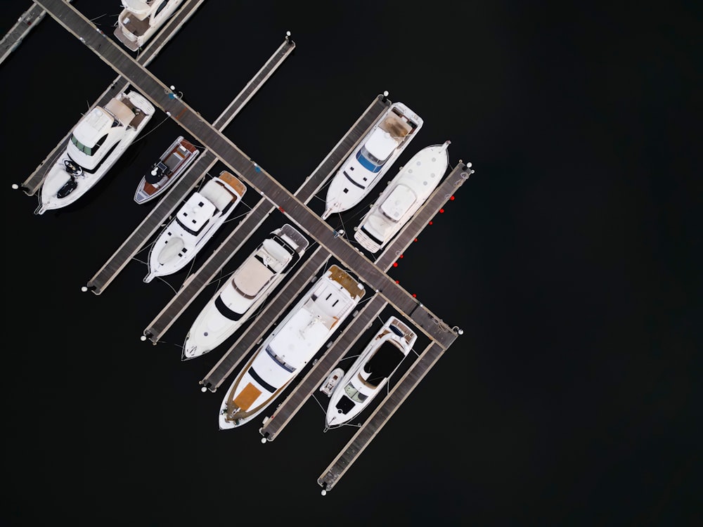 a group of boats are docked at a dock