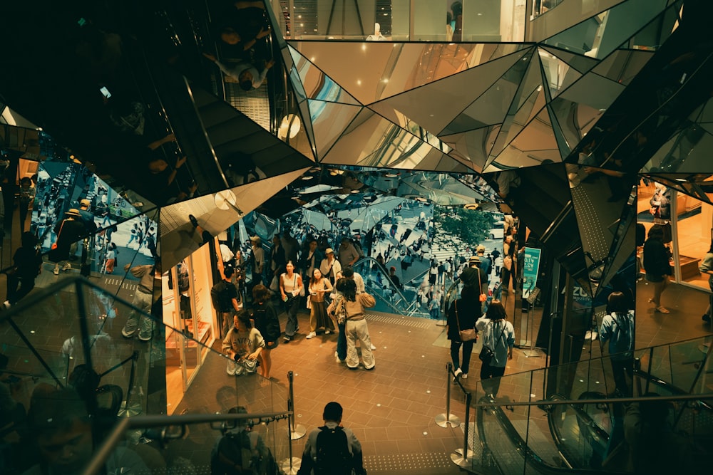 a group of people walking around a building