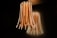 A unique and modern light fixture hangs from the ceiling, consisting of multiple long, flexible strips with embedded LED lights. The lights emit a warm glow against a dark background, creating an ambient atmosphere with the light reflecting on the wall.