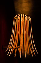 Artistic shot of a luxury LED pendant light illuminating a stylish dining area.