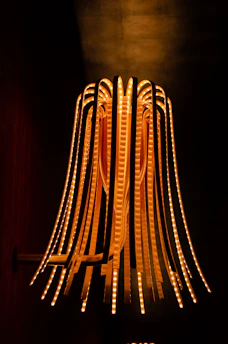 Artistic shot of a luxury LED pendant light illuminating a stylish dining area.