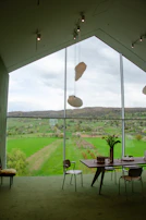 Elegant hotel room with large windows overlooking the serene landscape.