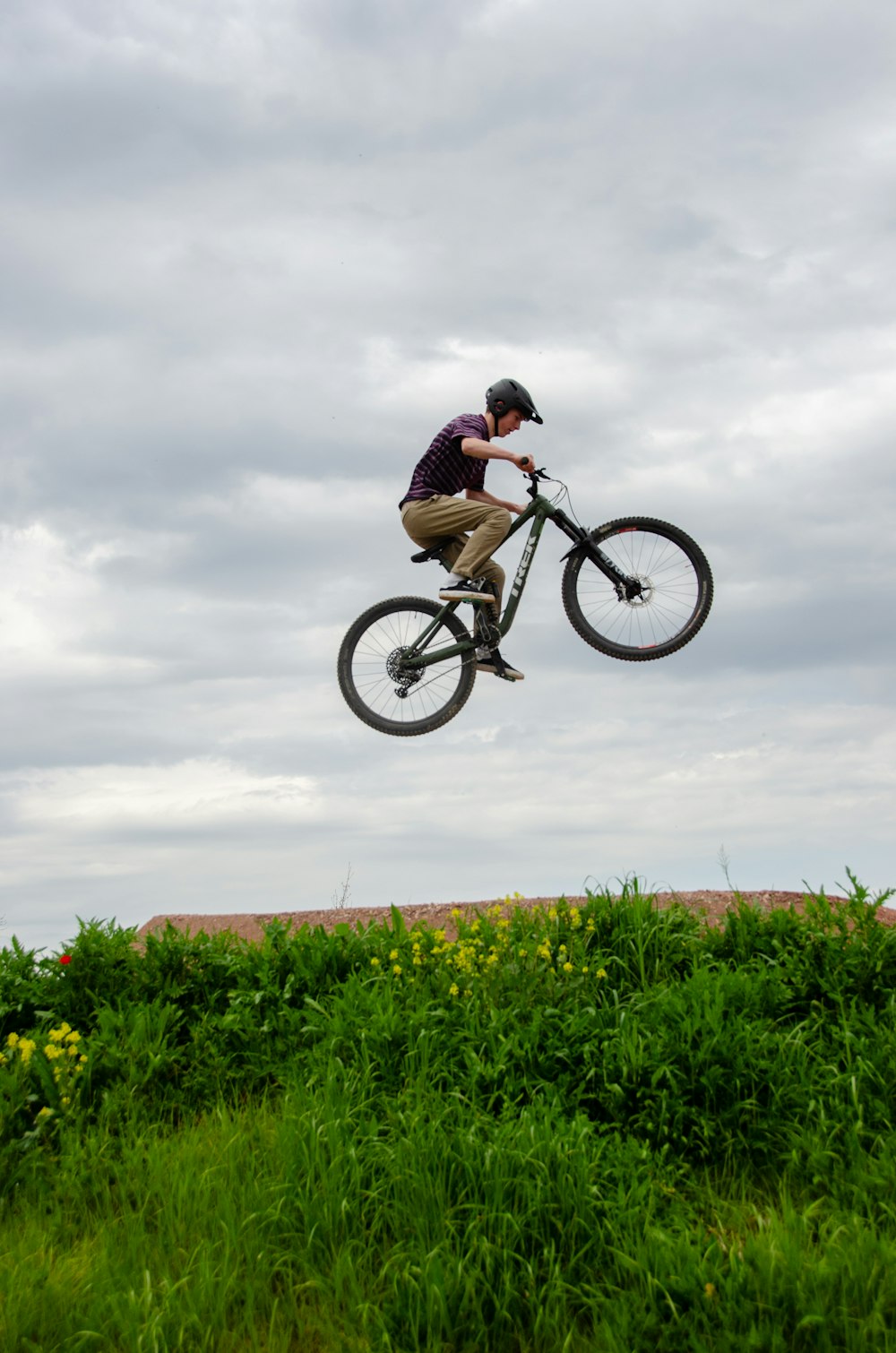 a person jumping a bike in the air