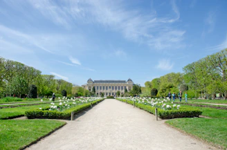 a large building with a garden in front of it