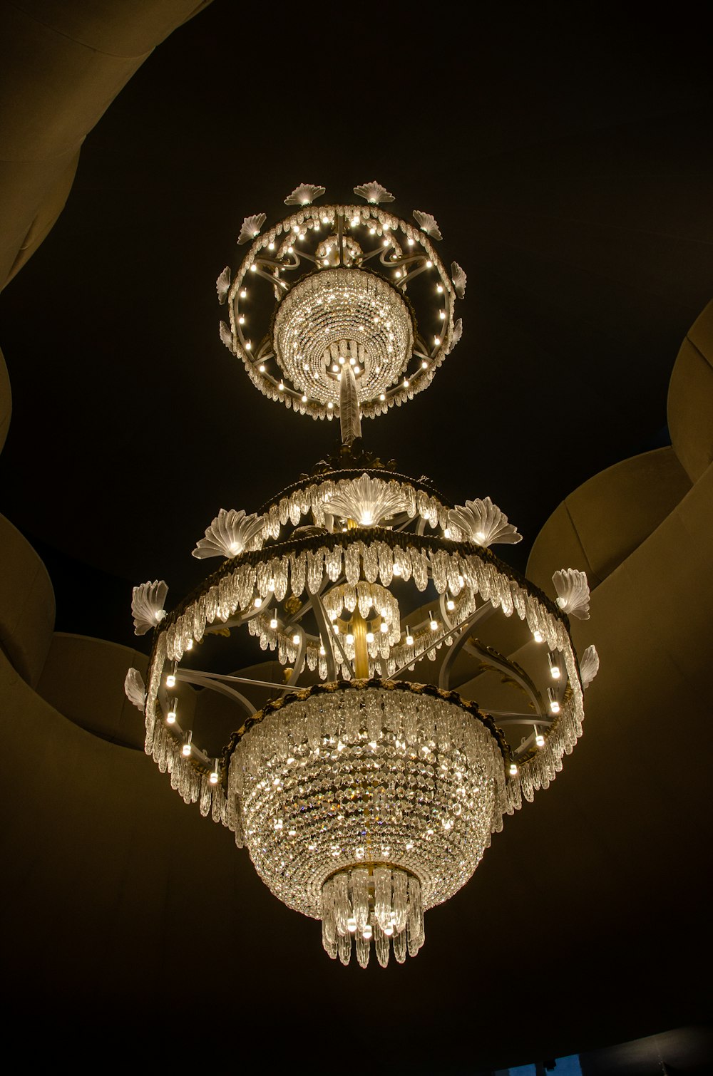 a chandelier hanging from the ceiling in a room