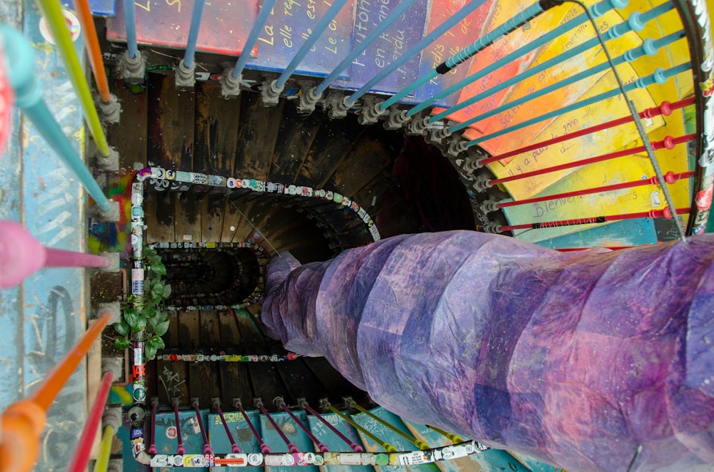 a spiral staircase made out of colored paper