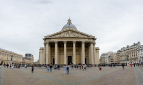 a group of people standing in front of a building