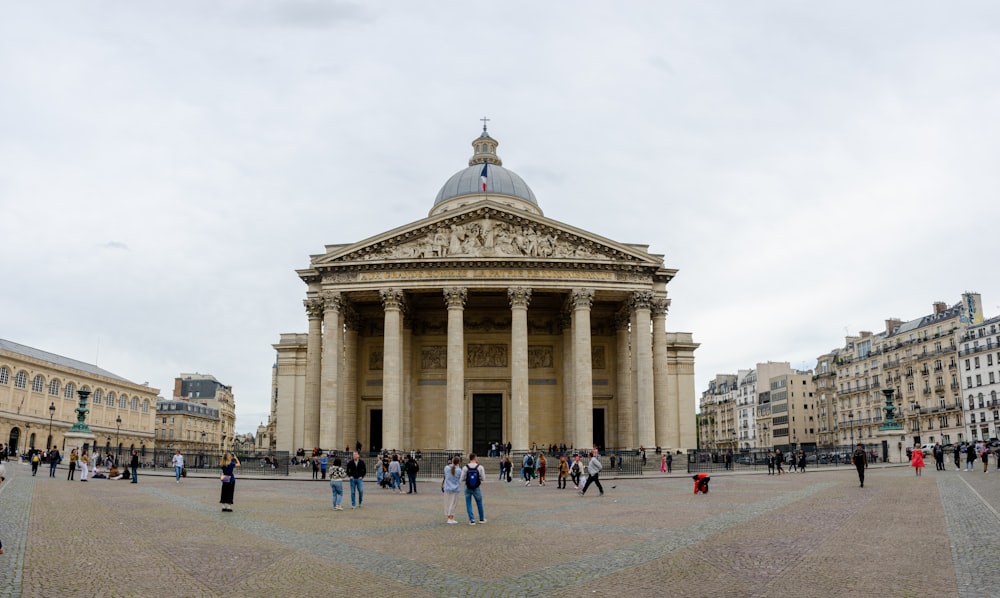 a group of people standing in front of a building