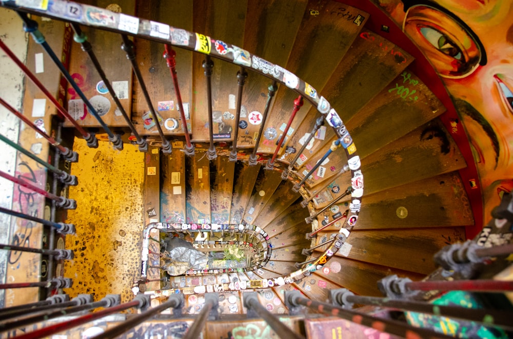 a spiral staircase with lots of stickers on it