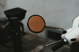 Close-up of a water scooter's handle with sparkling water droplets.