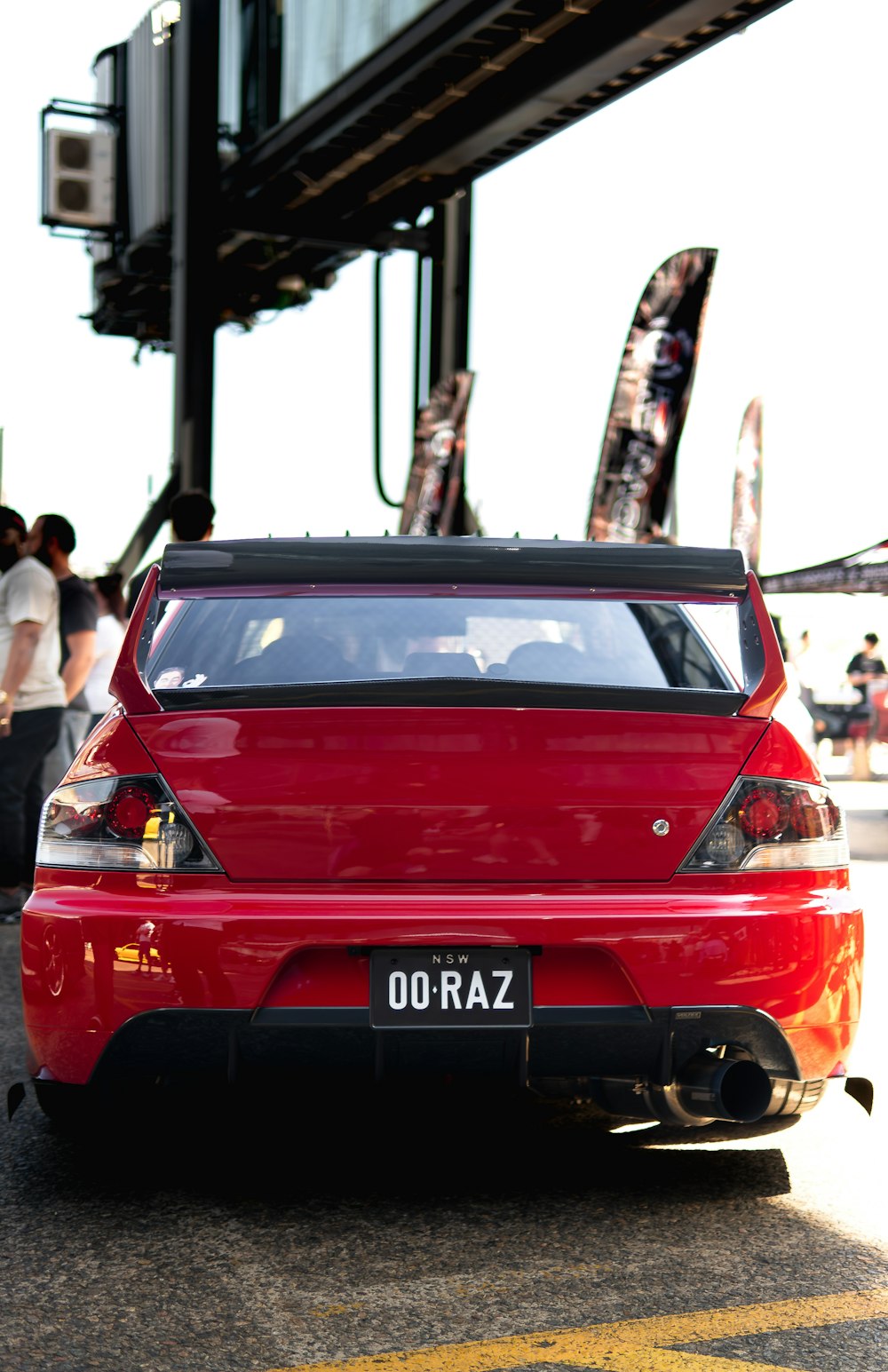 a red car parked on the side of the road