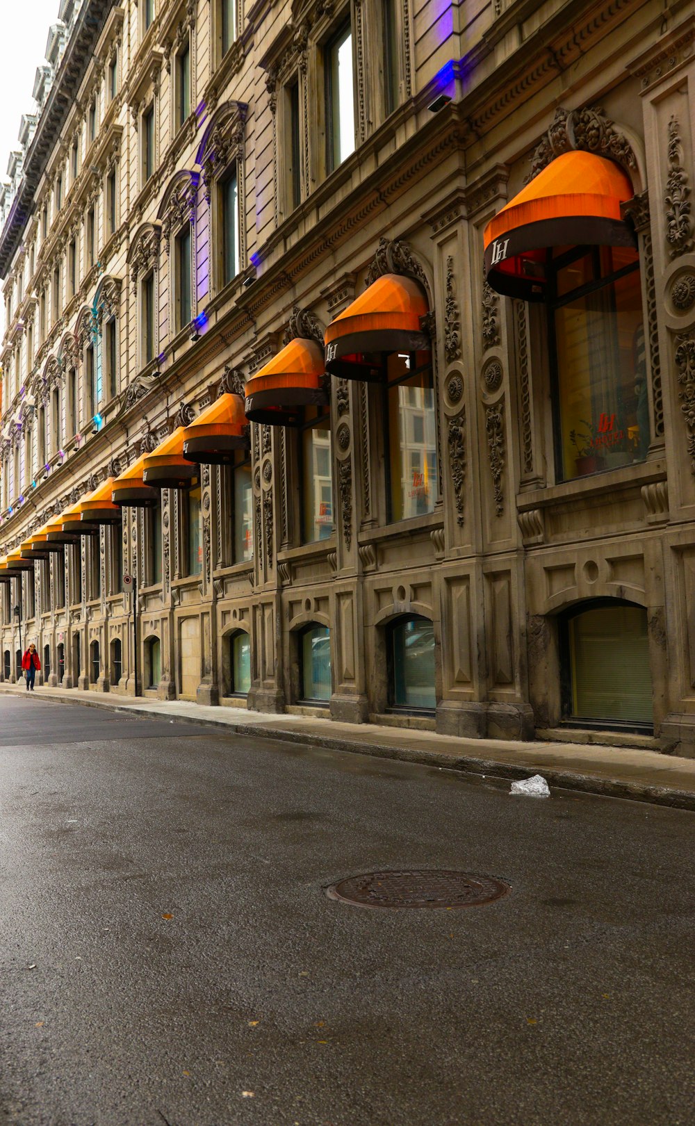 a city street with a row of tall buildings