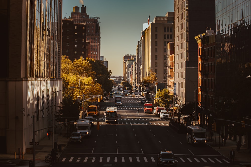 a city street filled with traffic and tall buildings