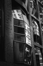 a black and white photo of a building with many windows