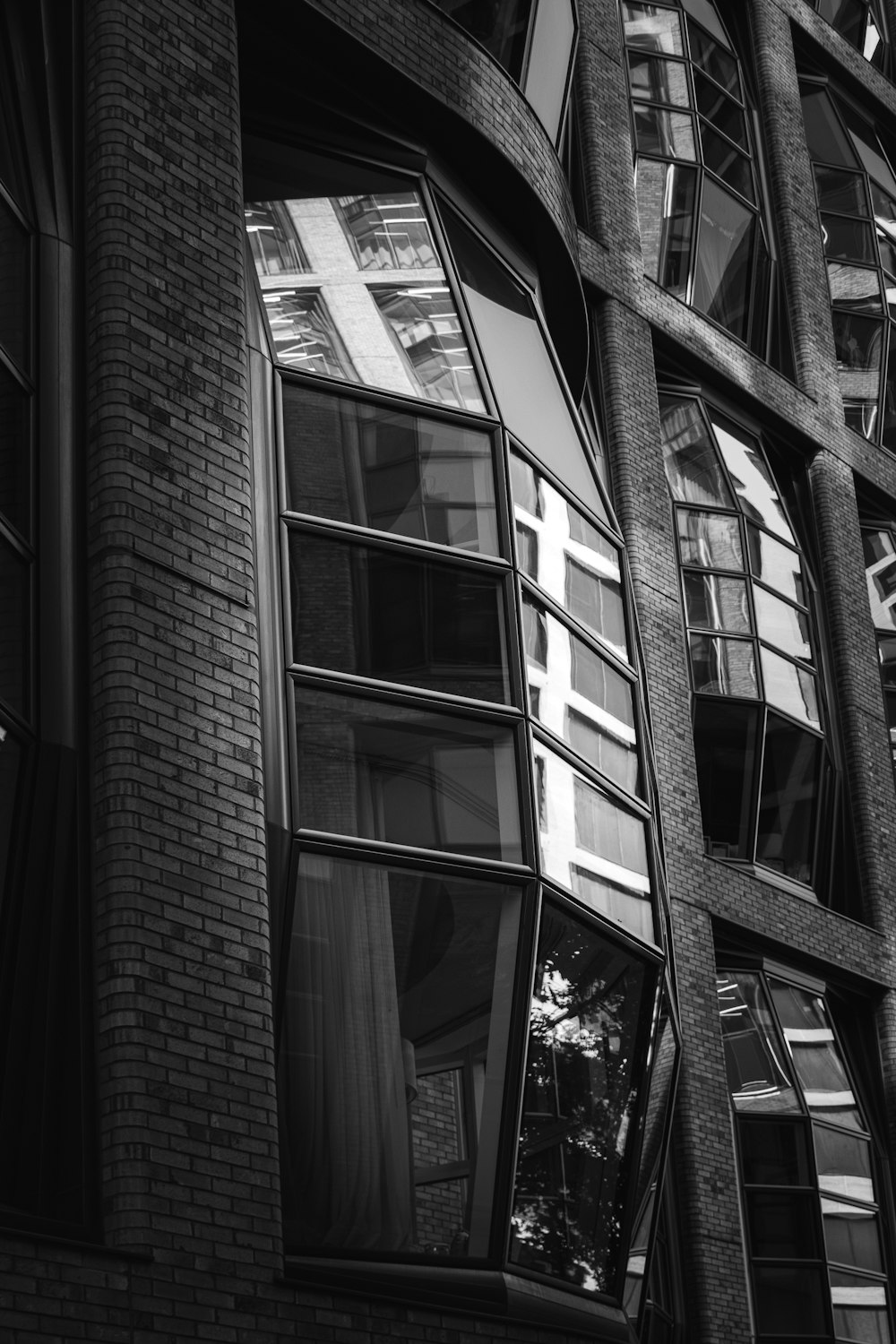 a black and white photo of a building with many windows