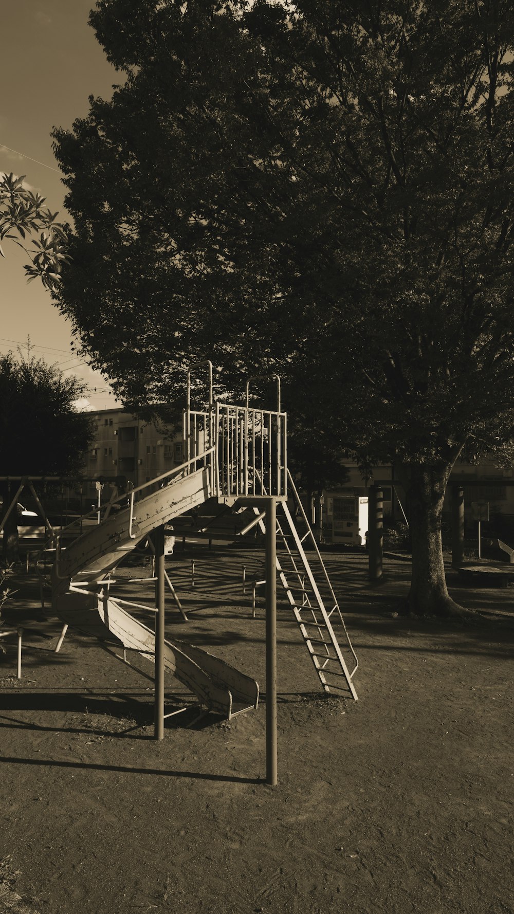 a black and white photo of a playground