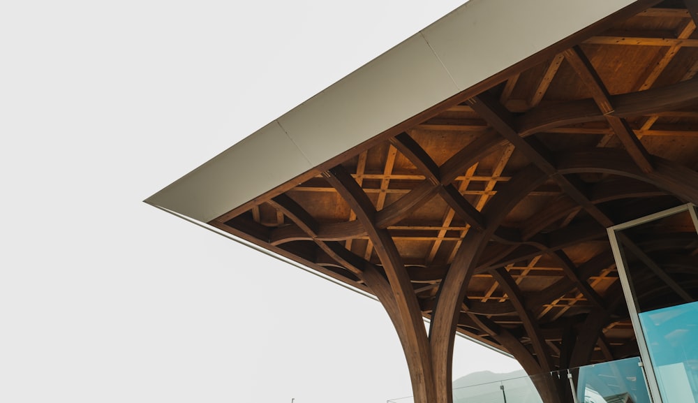 a large wooden structure with a clock on the side of it