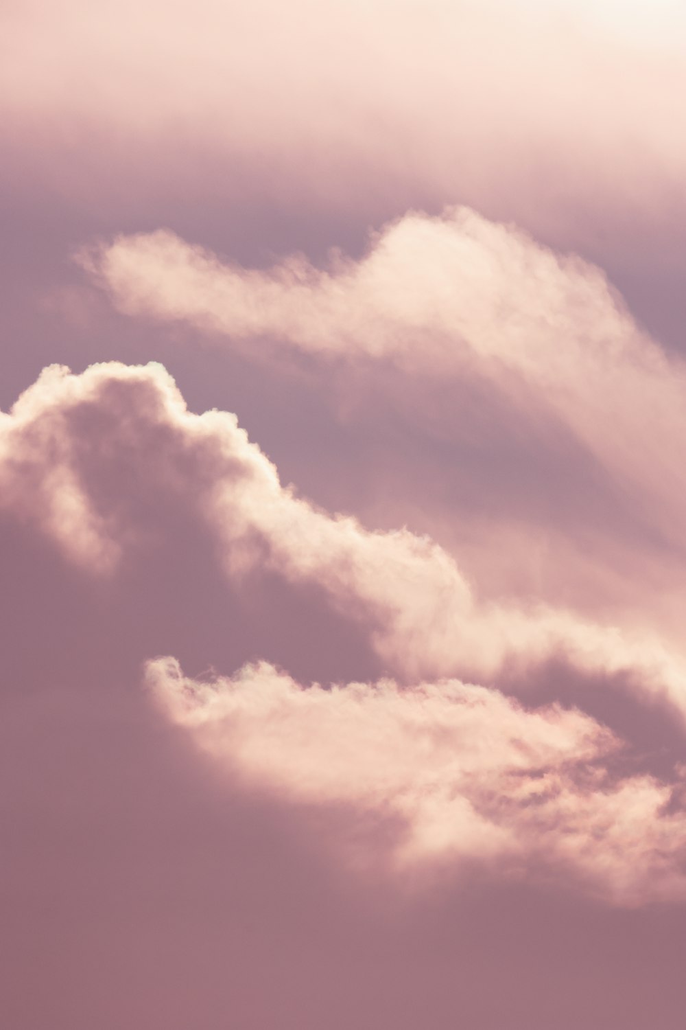 a plane flying in the sky with a lot of clouds