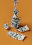 a stack of money sitting on top of a table