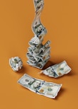 a stack of money sitting on top of a table