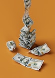 a stack of money sitting on top of a table