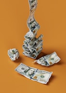 a stack of money sitting on top of a table