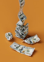 a stack of money sitting on top of a table
