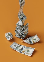 a stack of money sitting on top of a table