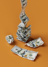 a stack of money sitting on top of a table