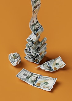 a stack of money sitting on top of a table