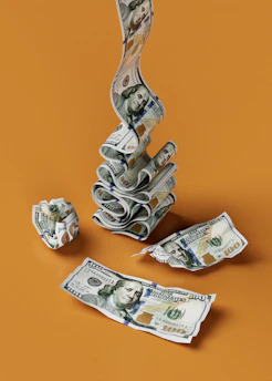 a stack of money sitting on top of a table